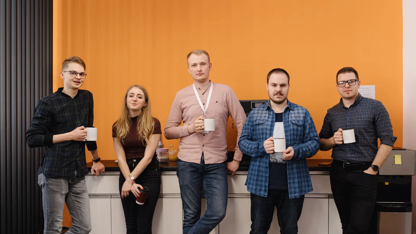 All Coderwan staff are relaxing, enjoying coffee, and chatting.