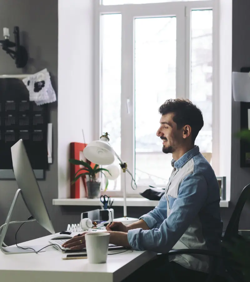 A software engineer working on a desktop computer.