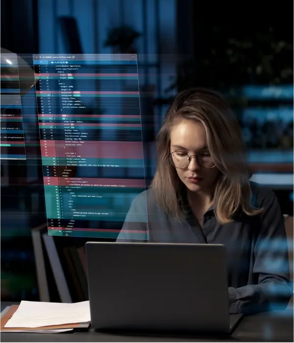 She is writing code to develop software as part of a remote team.