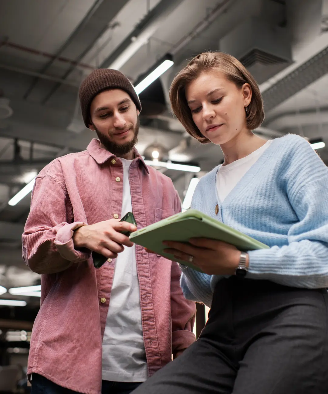 A team member is explaining to her about pre-screened tech talent.